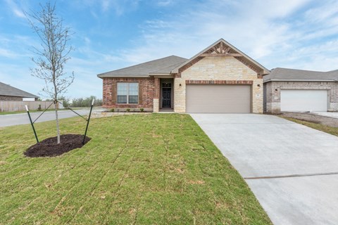 a house with a driveway and a garage door