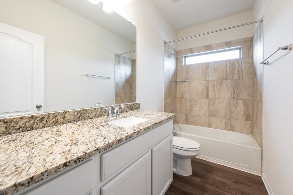 a bathroom with a sink toilet and a shower