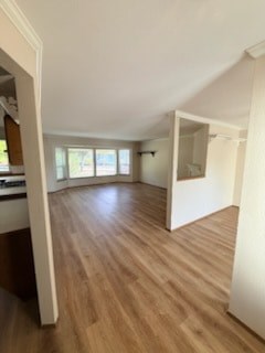 A room with wooden floors and white walls.