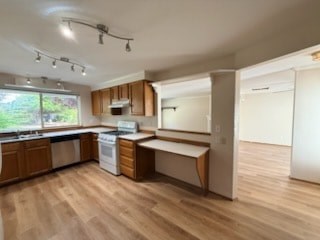 A kitchen with wooden floors and a large island.