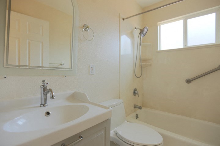 a bathroom with a sink toilet and a shower
