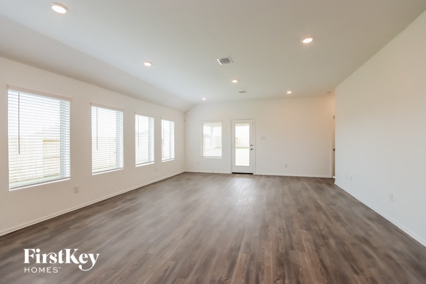 the living room is clean and ready to be used as a home office