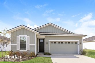the front of a house with a garage door
