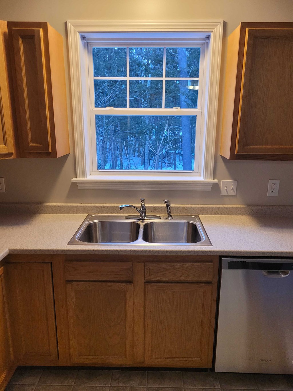 a kitchen with a sink and a window