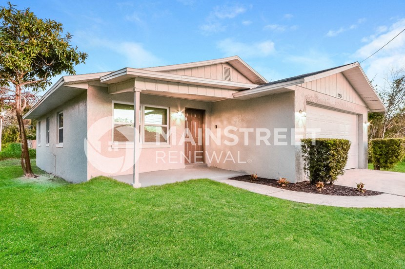 a house with a lawn in front of it