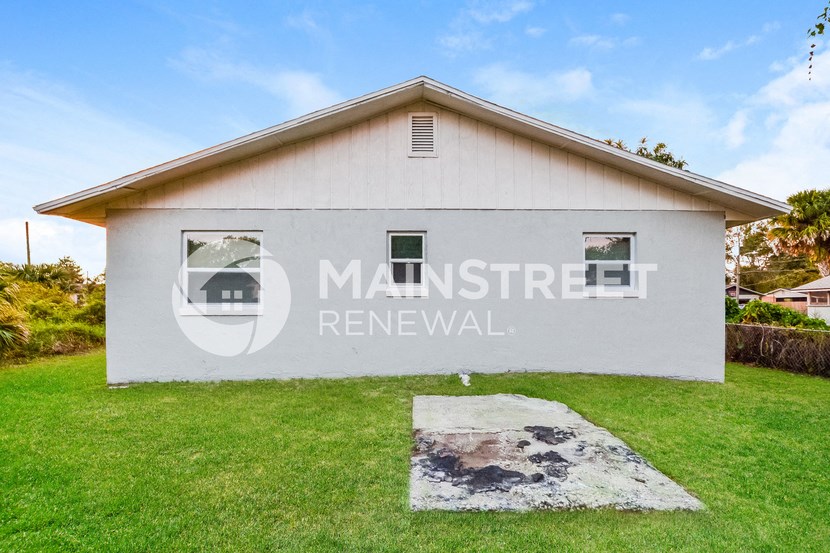 renovated home for sale in the middle of a neighborhood