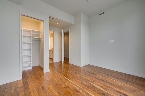 A room with wooden floors and white walls.