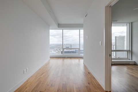 A room with wooden floors and white walls.