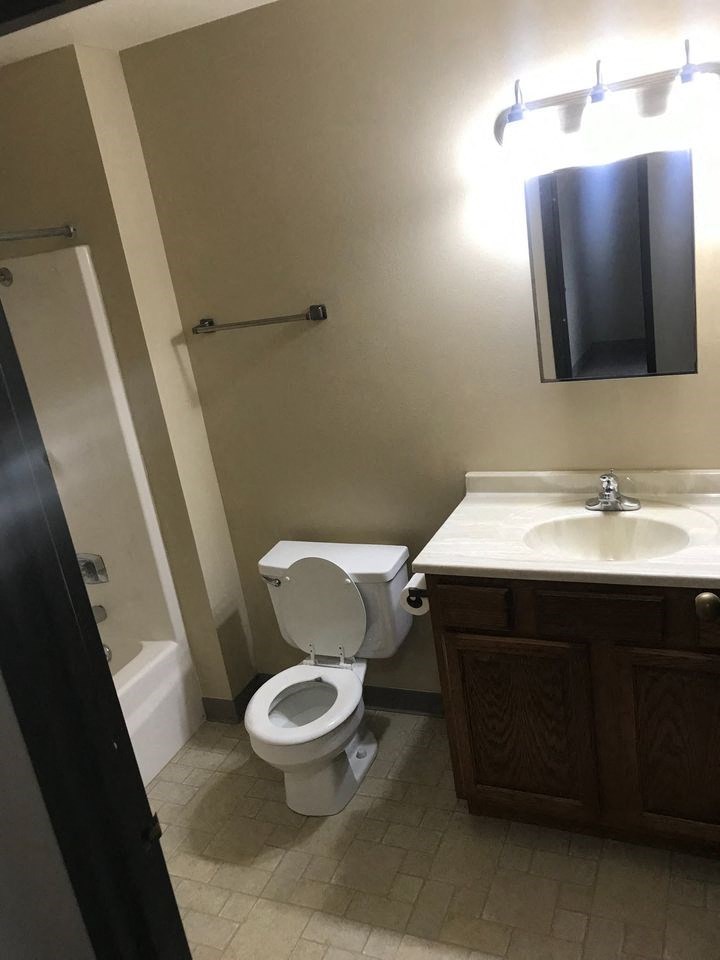 a bathroom with a toilet and a sink