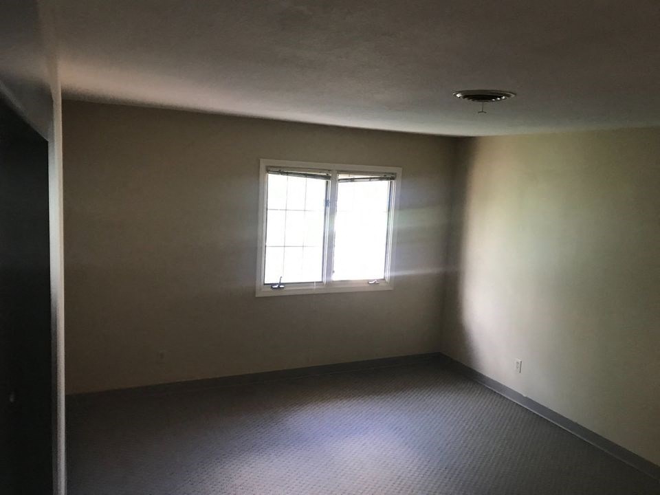 an empty room with a window in it