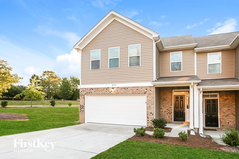 A house with a garage is shown in the image.