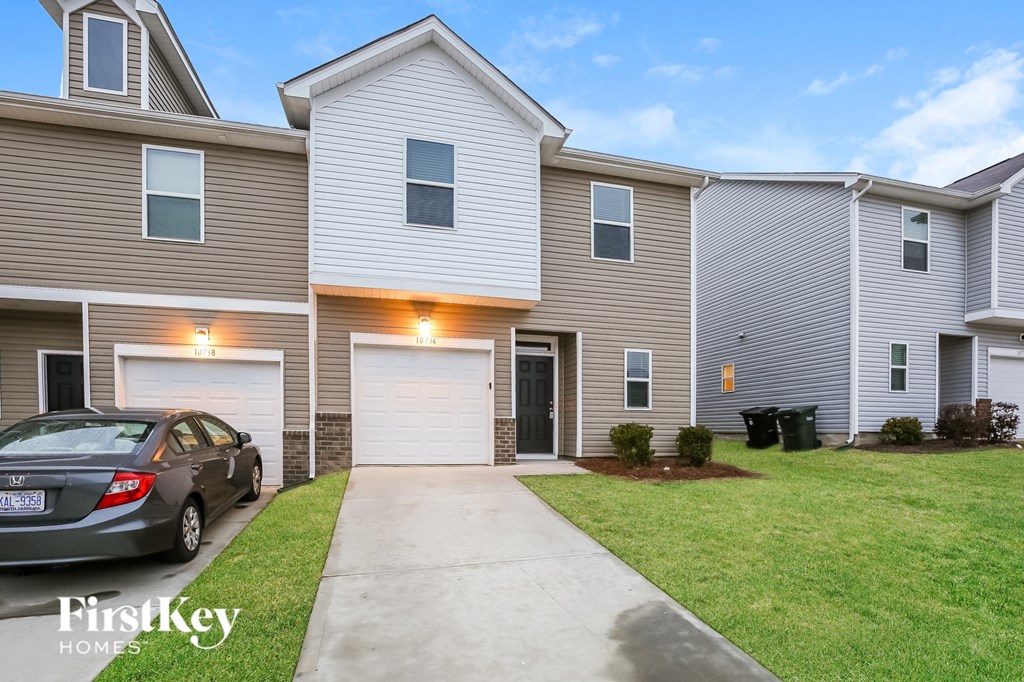 A car is parked in front of a house with the words "FirstKey Homes" on the bottom left.