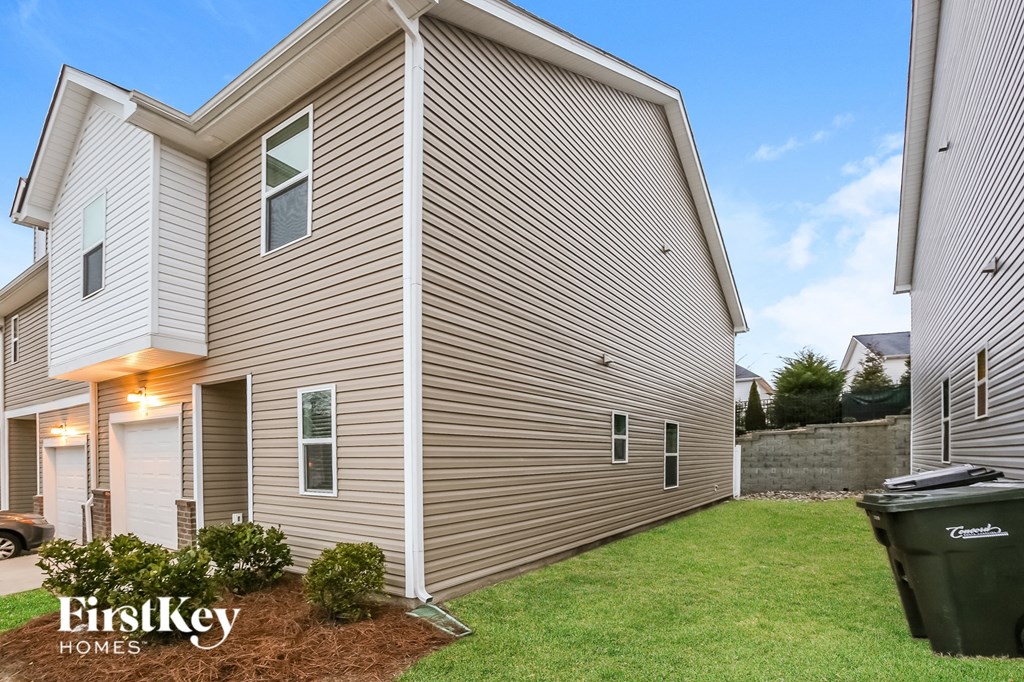 A modern house with a garage and a driveway.