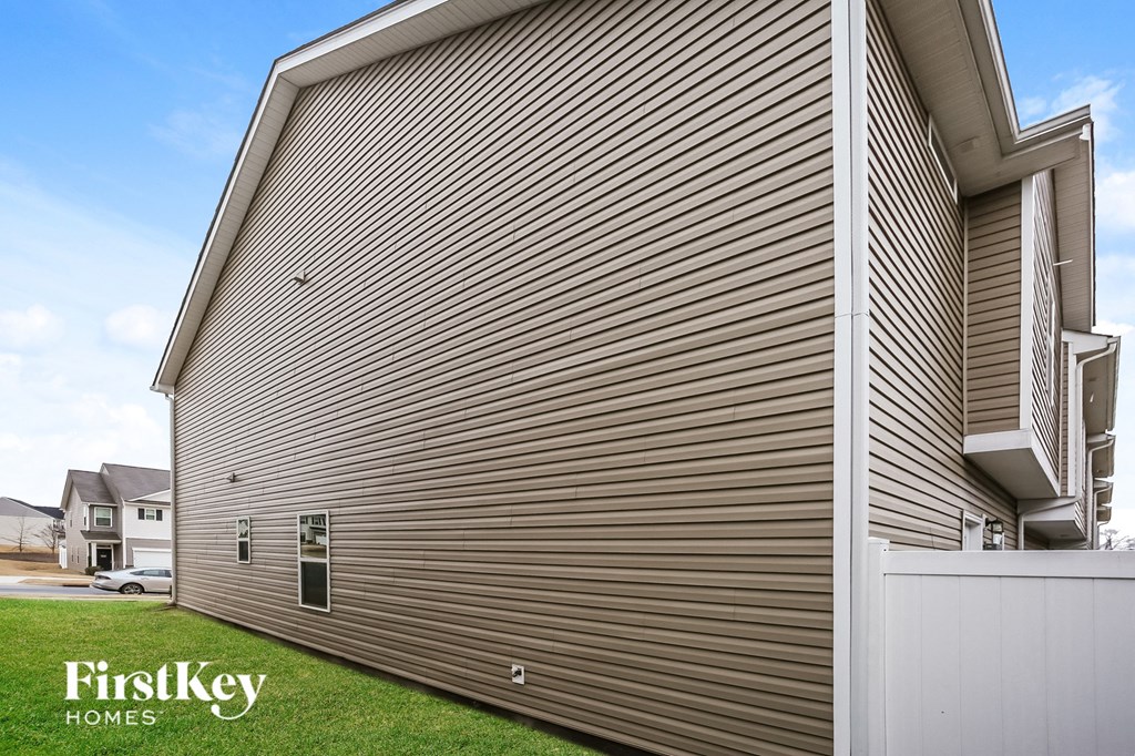 A house with a FirstKey Homes sign on the side.