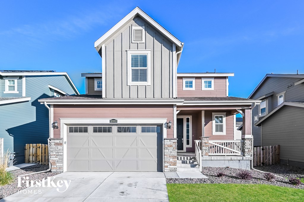 A house with a garage and a front porch.