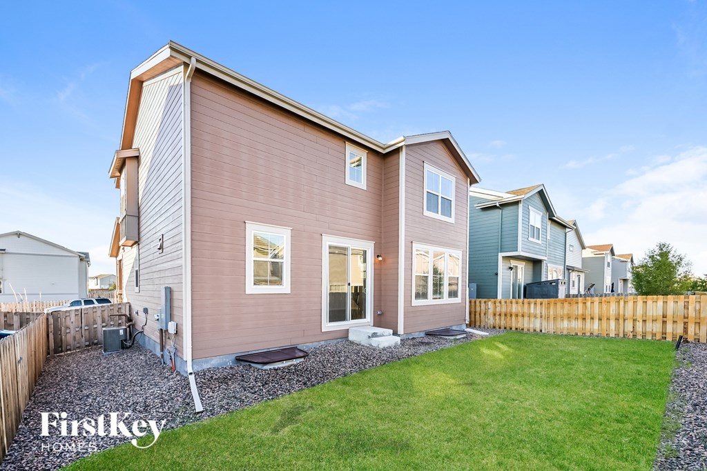 A house with a brown and white exterior is shown with the words "Firstkey Homes" on the bottom left.
