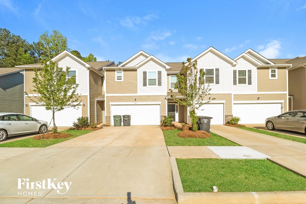 A row of houses with the words "FirstKey Homes" on the bottom left.