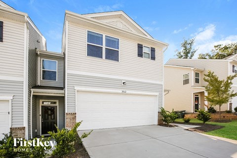 a white house with a white garage door