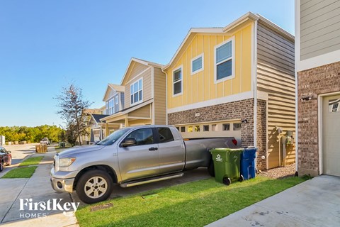 a truck parked in front of a house