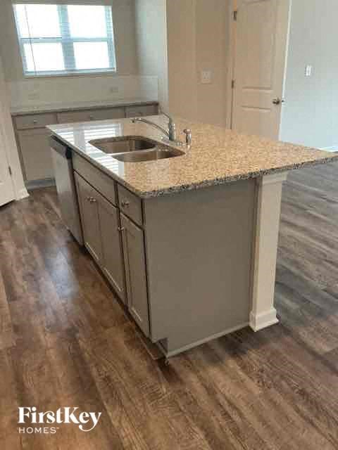a kitchen with a sink and a counter top