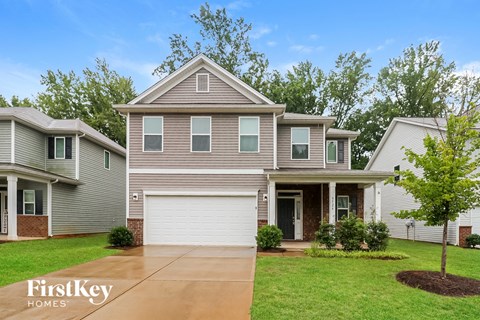 A house with a garage is shown in the image.