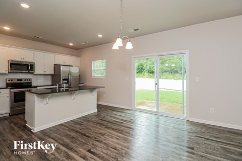 A kitchen with a FirstKey Homes logo.