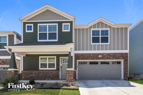 A house with a garage is for sale by FirstKey Homes.