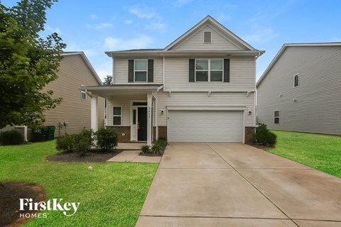 A house with a garage is for sale by FirstKey Homes.