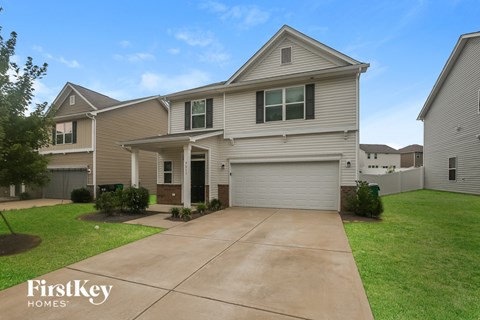 A house with a garage is for sale by FirstKey Homes.