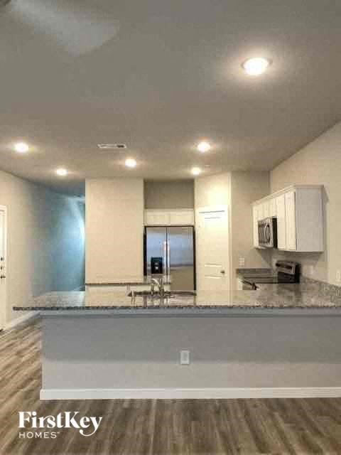 a kitchen with a counter top and a sink