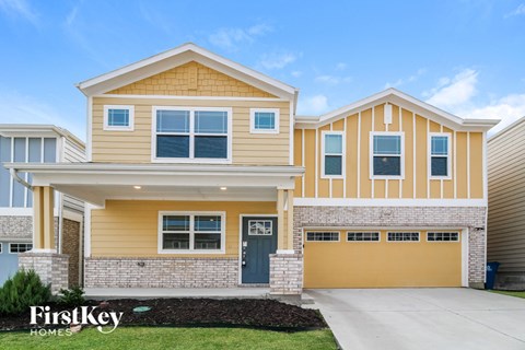 a yellow and with a yellow garage door