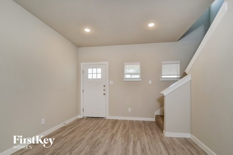 the upstairs bedroom is spacious and has a door to the hallway
