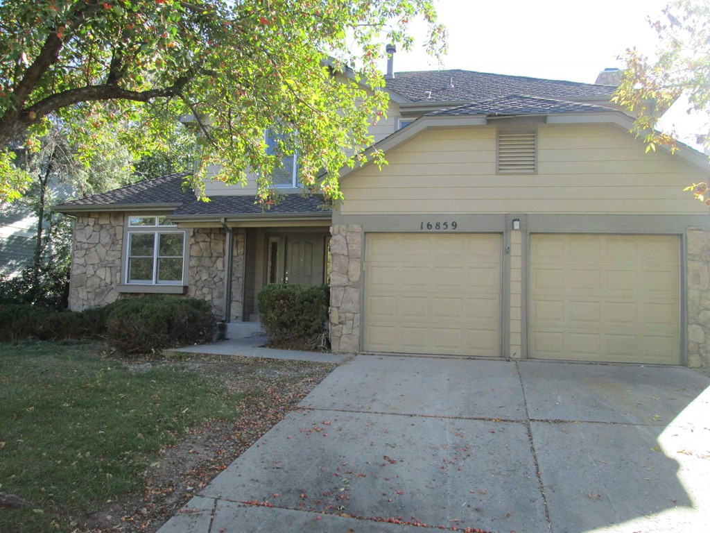 A house with the number 16859 on the garage door.