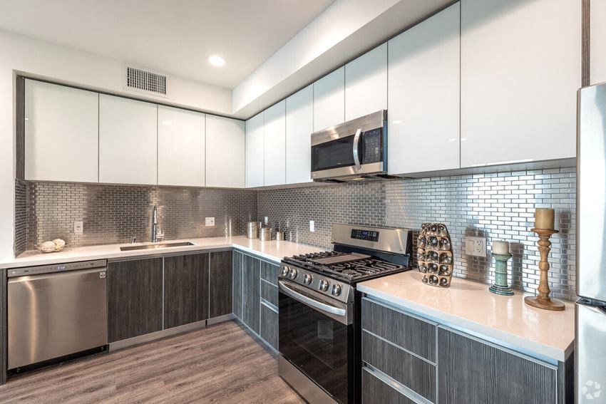 a kitchen with a stove and a microwave
