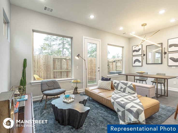 a living room with a couch and a table