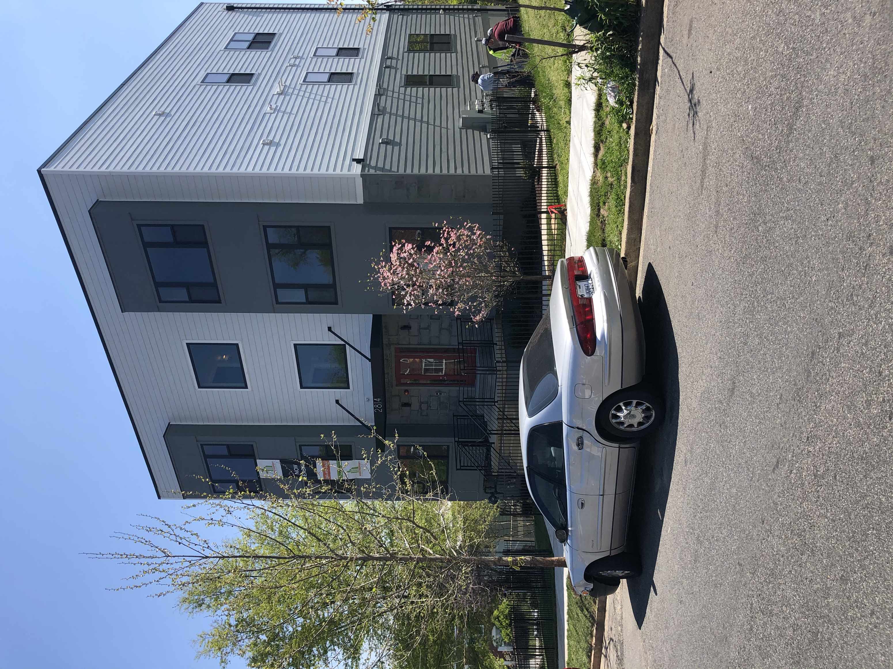 a house with a car parked in front of it