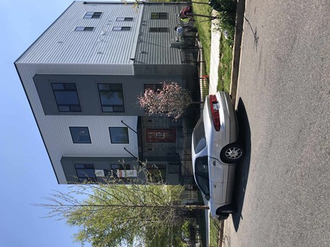 a house with a car parked in front of it