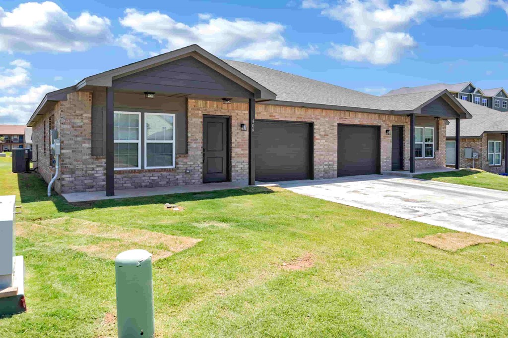 a house with a garage and a lawn