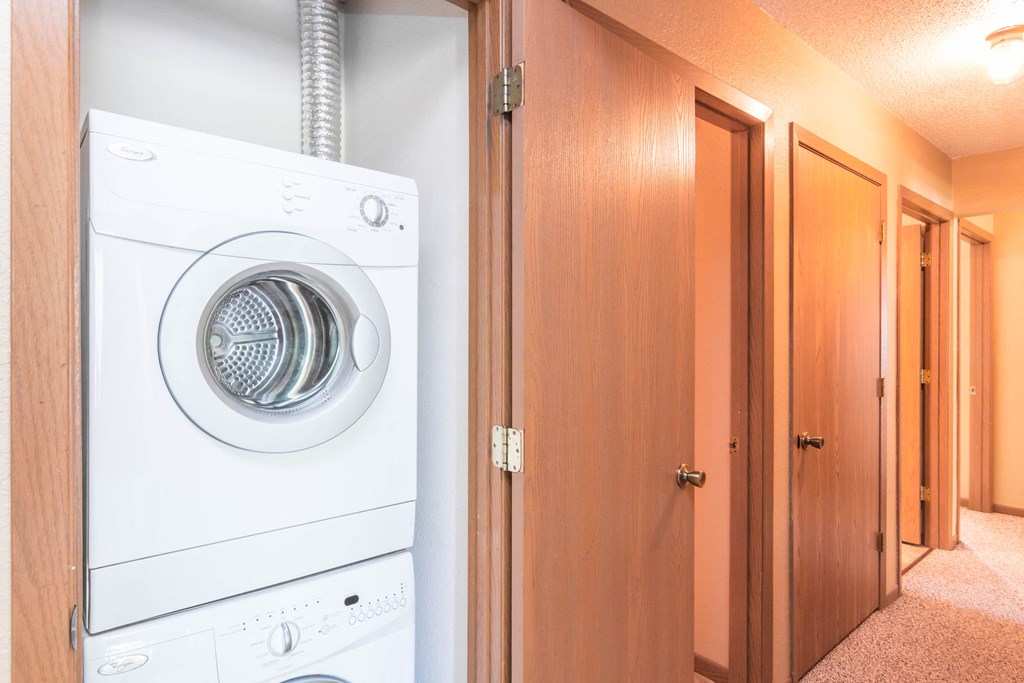a washing machine and dryer in a laundry room