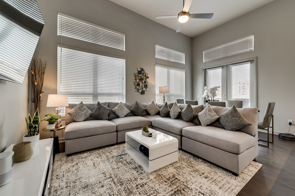 a living room with a large couch and a coffee table