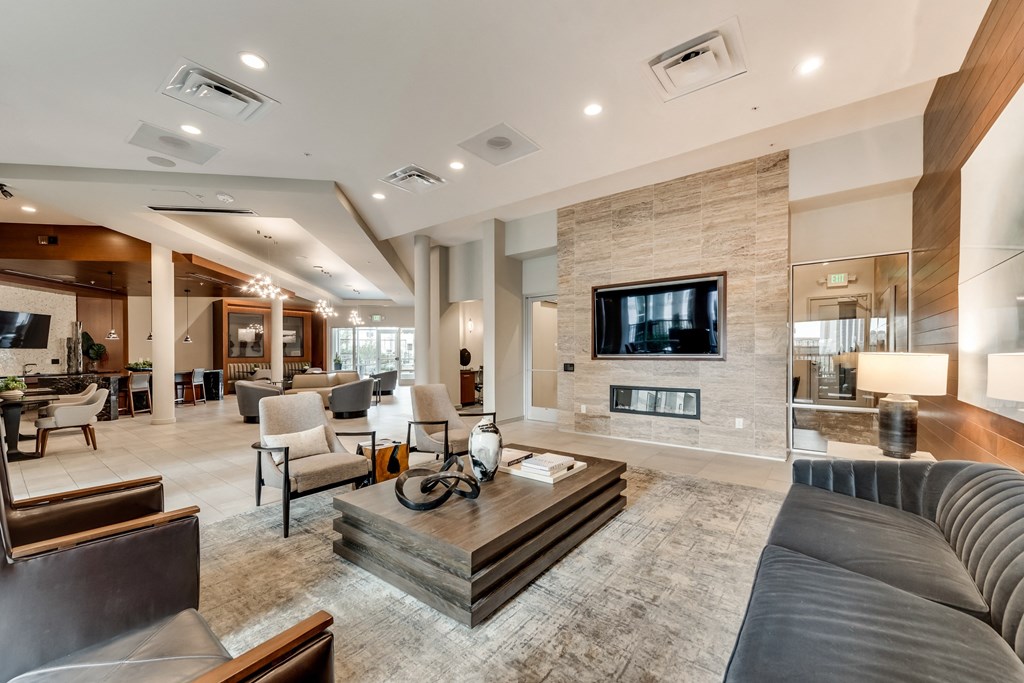 a large living room with a fireplace and a television