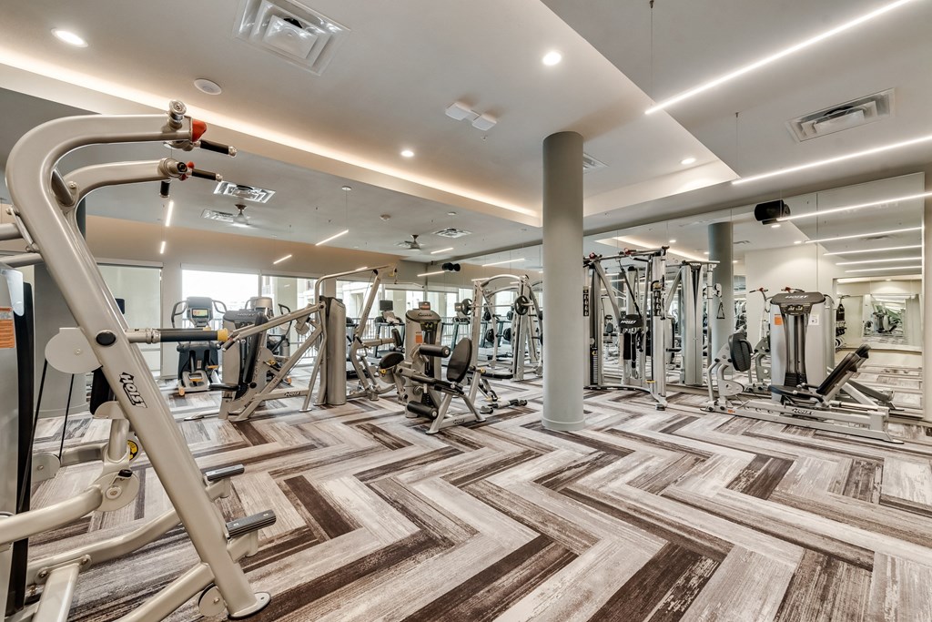 a gym with treadmills and other exercise equipment
