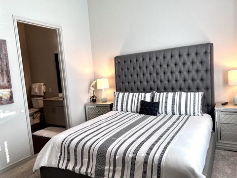 the master bedroom has a king sized bed and ensuite bathroom