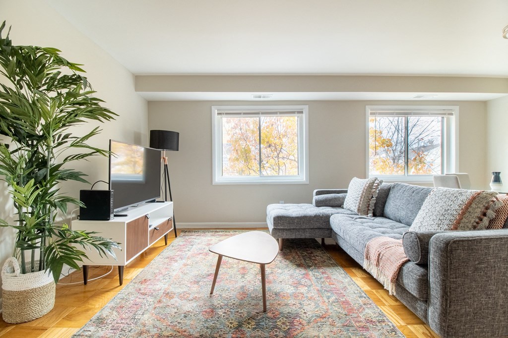 a living room with a couch and a tv