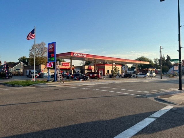 a gas station on the side of a road