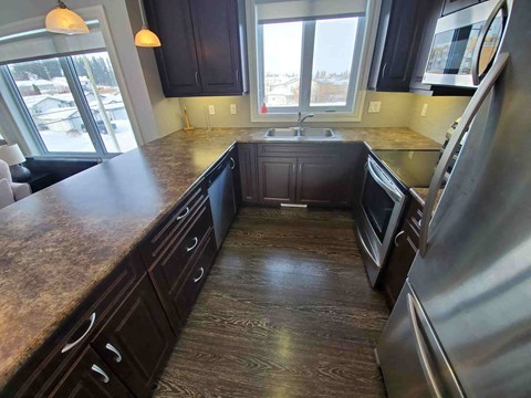 a kitchen with a counter top and a sink