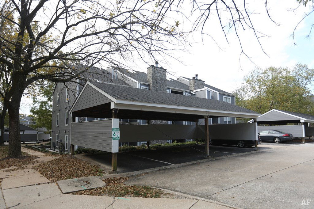 the front of a house with a parking lot