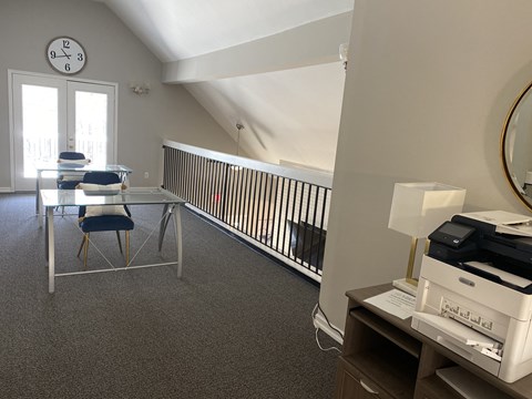 a dining room with a table and chairs on a balcony