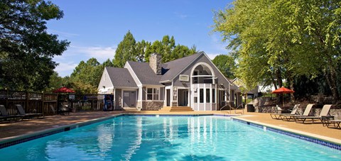 a swimming pool in front of a house