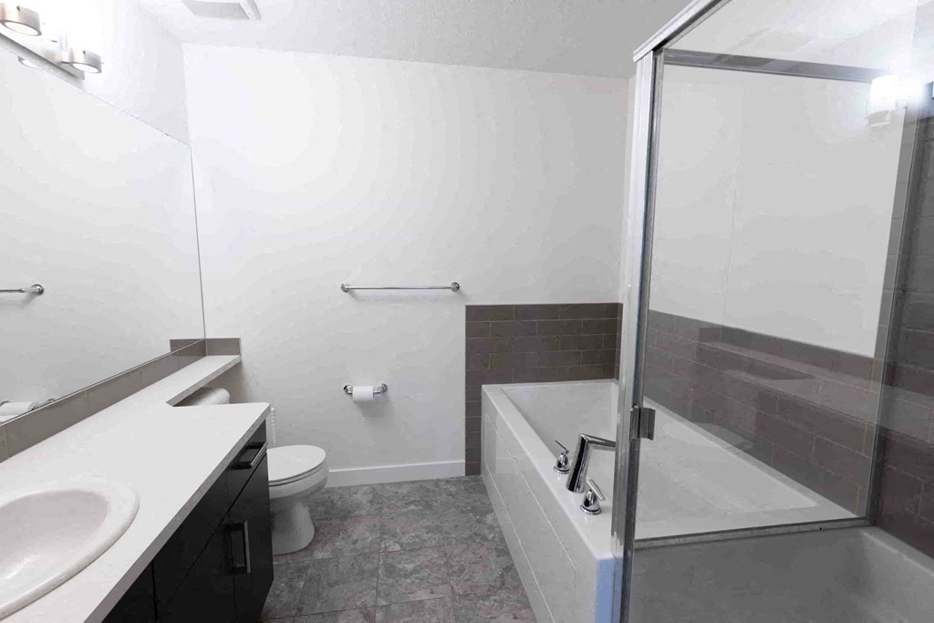 a bathroom with a sink toilet and a shower